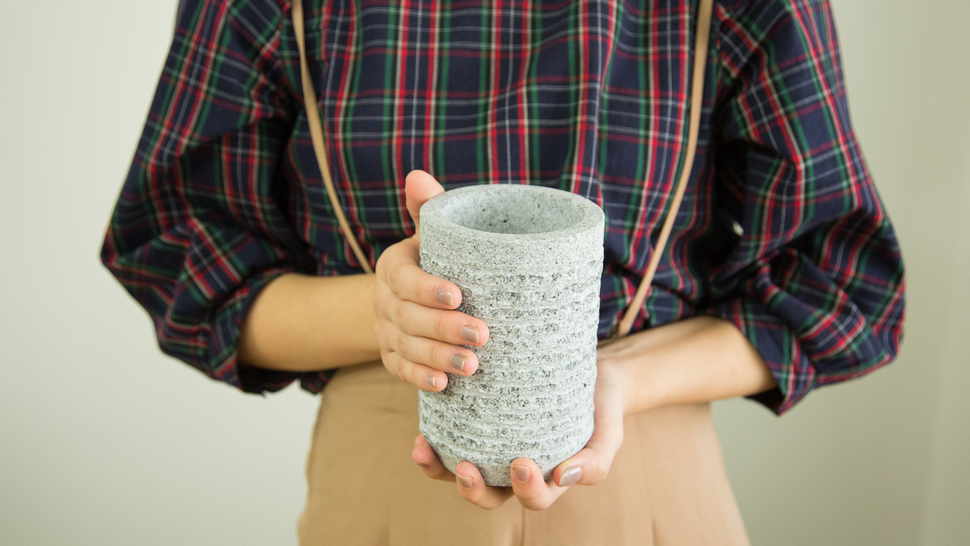 woman-holding-plastic-bottle