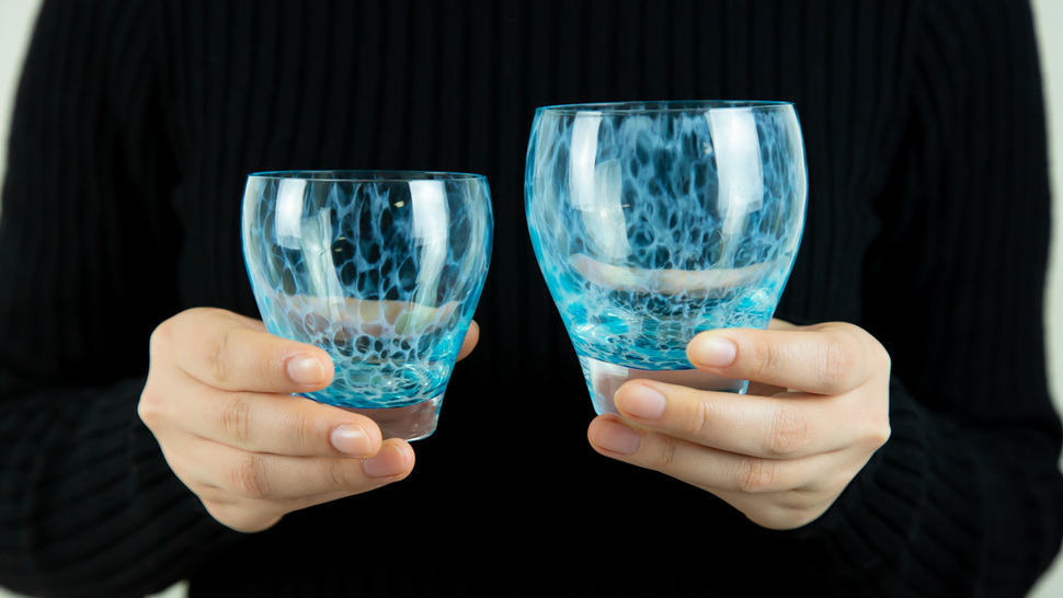 woman-holding-two-glasses