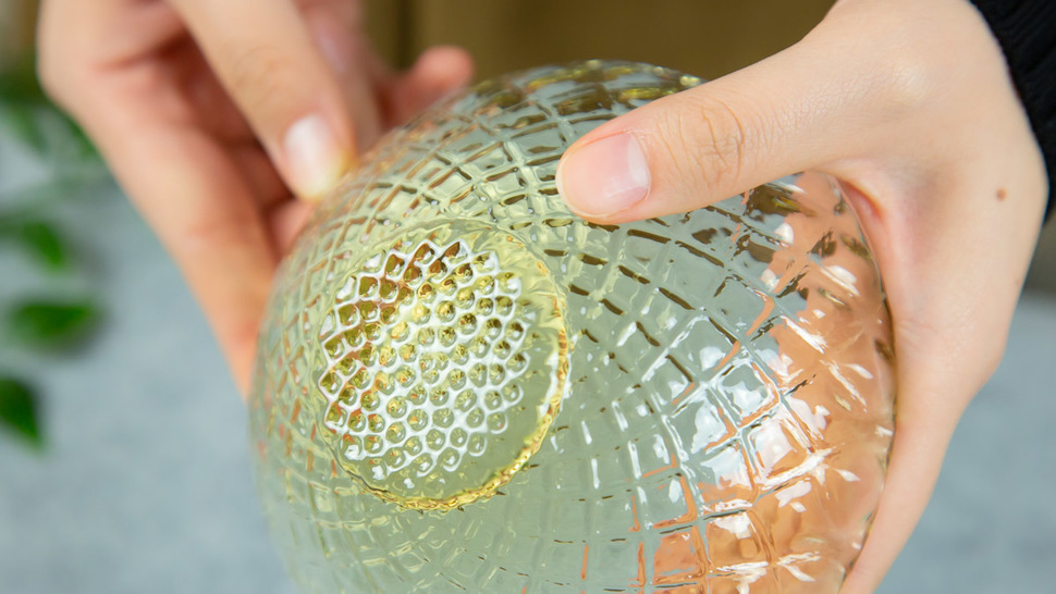 woman-touching-back-of-yellow-bowl